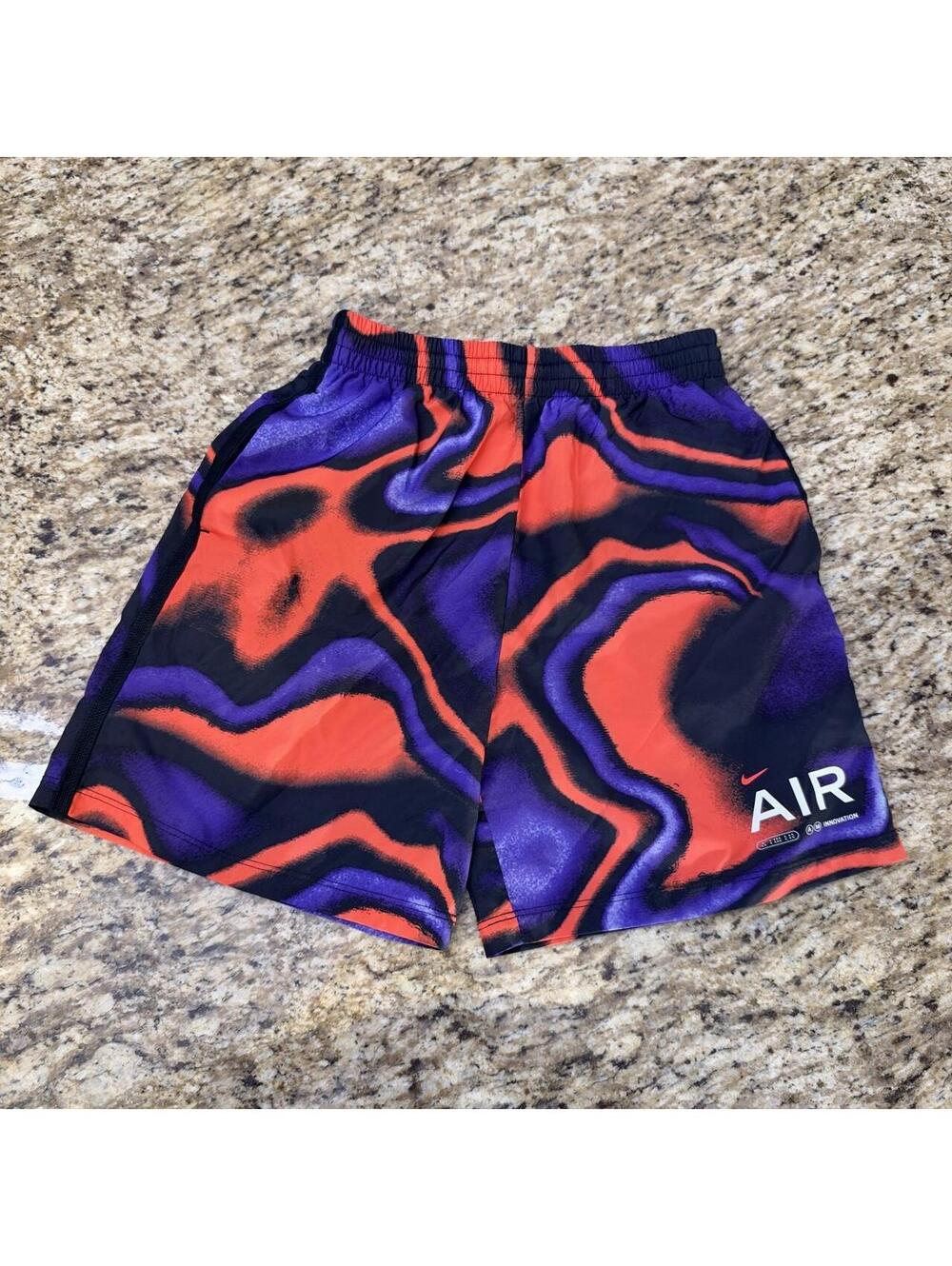Boys Nike Air shorts with orange and purple swirling abstract design